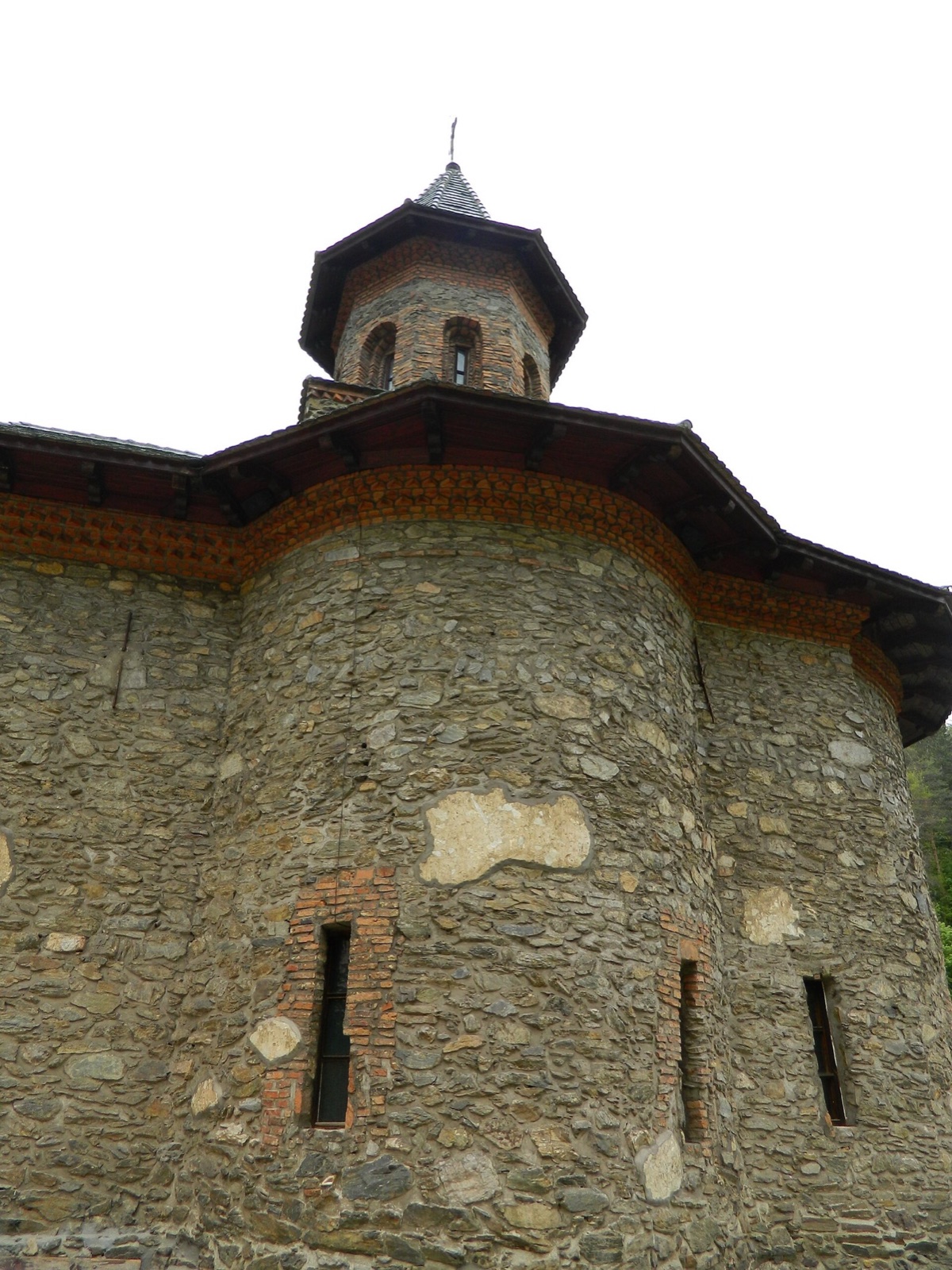 The church's stone wall and tower